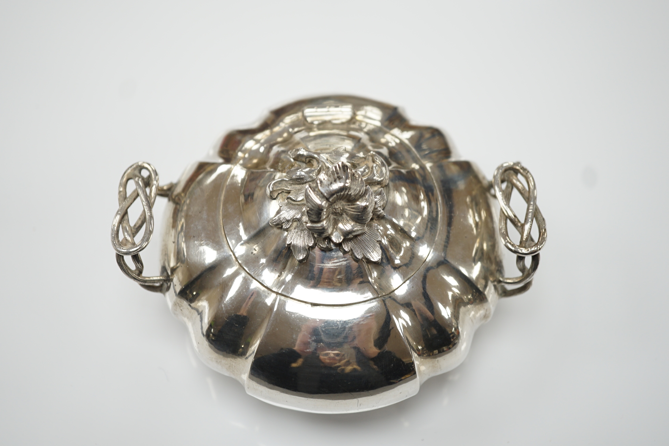 A mid 19th century Russian 84 zolotnik two handle sugar bowl and hinged cover, assay master possibly Vasily Surotsov, width over handles, 13.5cm, 10oz.